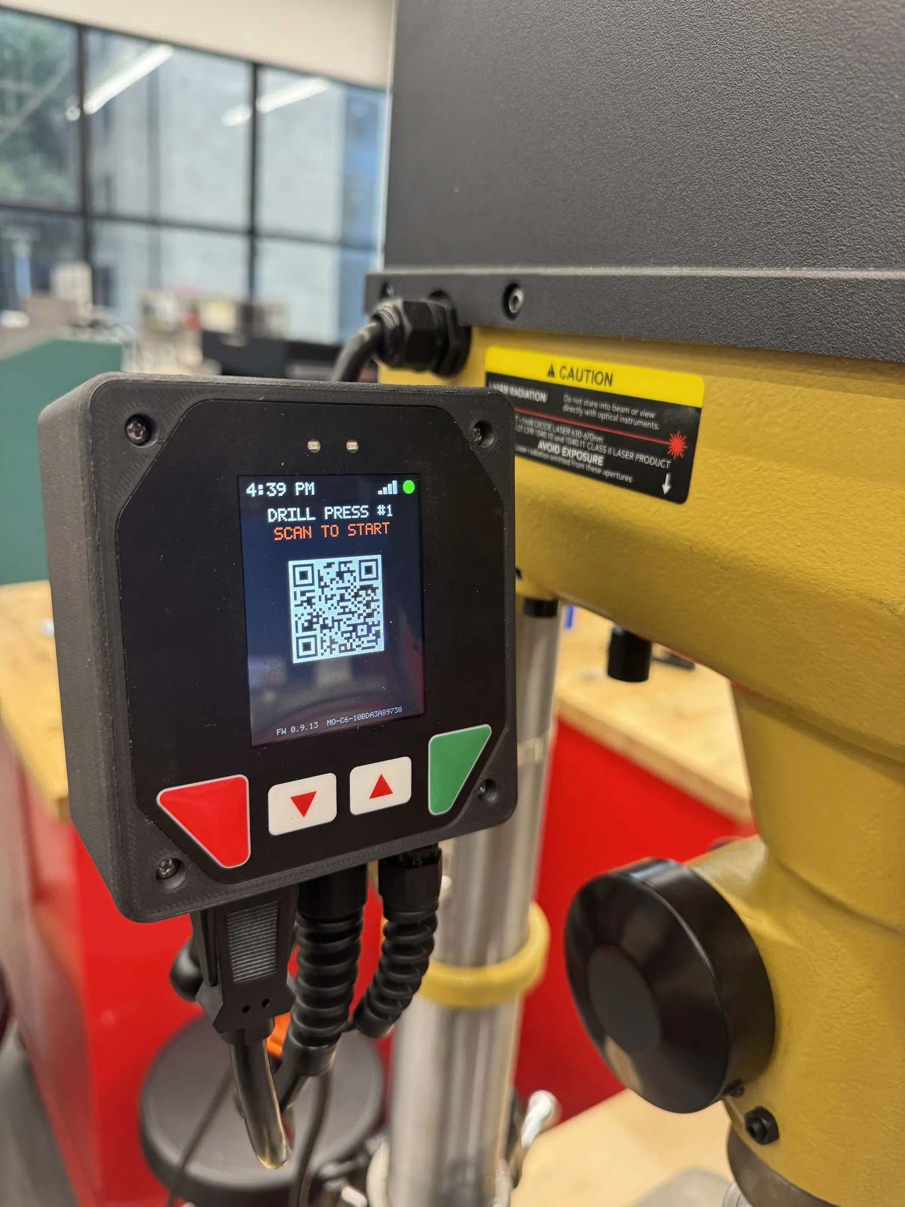 The MakerOps controller on a drill press, showing Drill Press #1 and a scan-to-start code